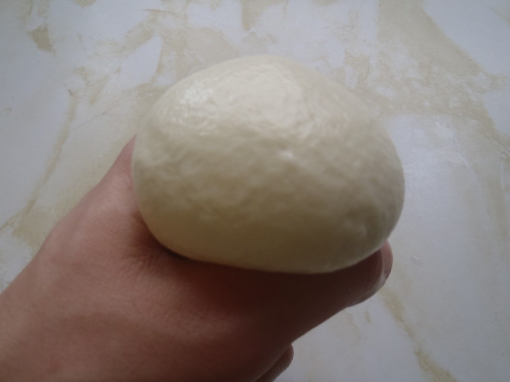Shaping fresh mozzarella into balls
