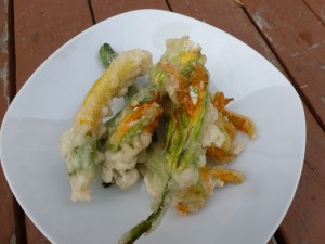 Squash blossoms, filled with cottage cheese and onions, battered and fried