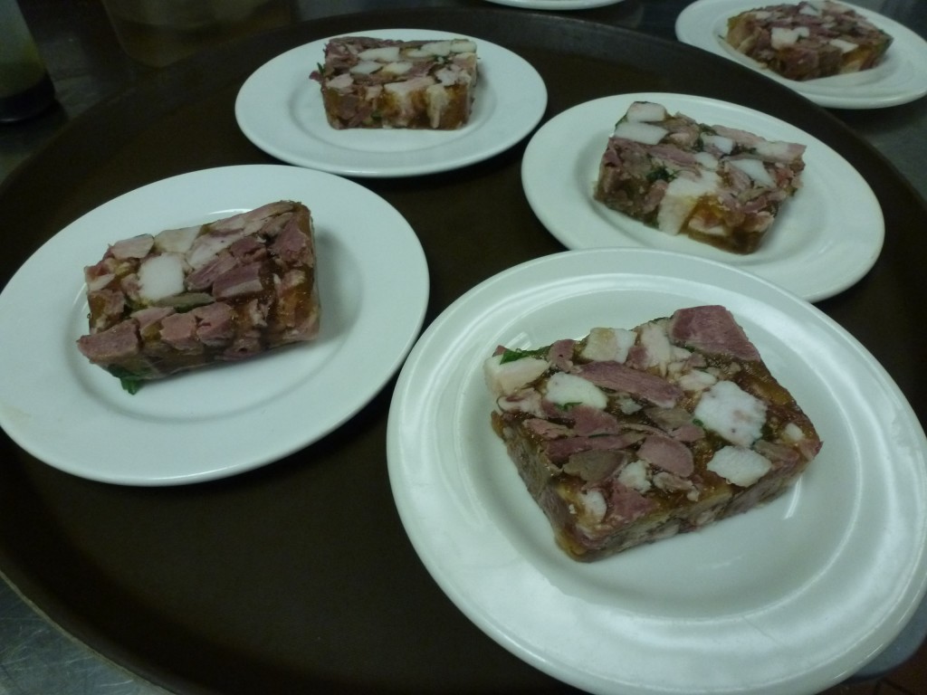 A few plates of headcheese, waiting for vinegar