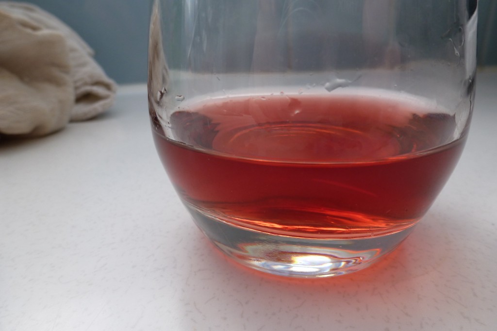 A glass of raspberry mead