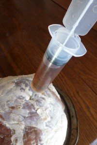 Injecting brine into a ham