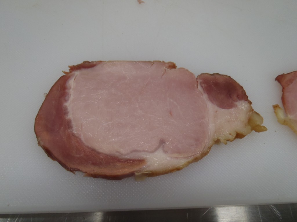 The rib section of the loin, cured as back bacon and sliced