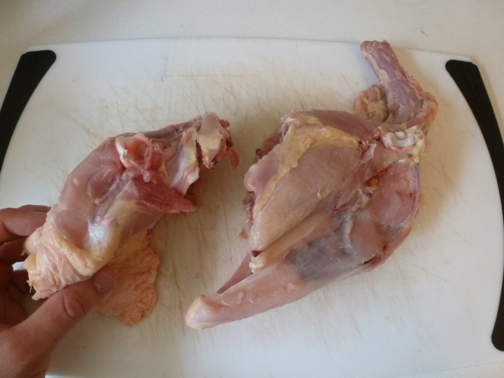 The chicken carcass, divided