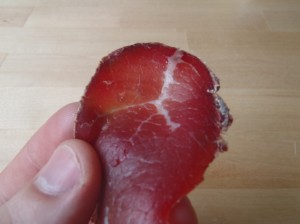 A bright red slice of air-dried beef