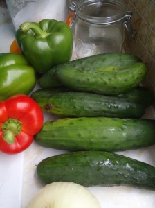 Cucumbers and peppers on the kitchen counter