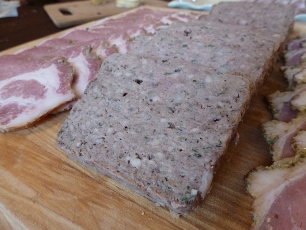 Slices of pork liver pâté on a charcuterie board