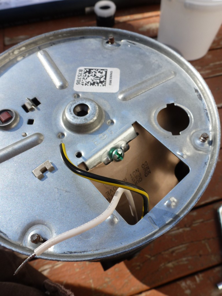 The electrical connections on the bottom of the garburator