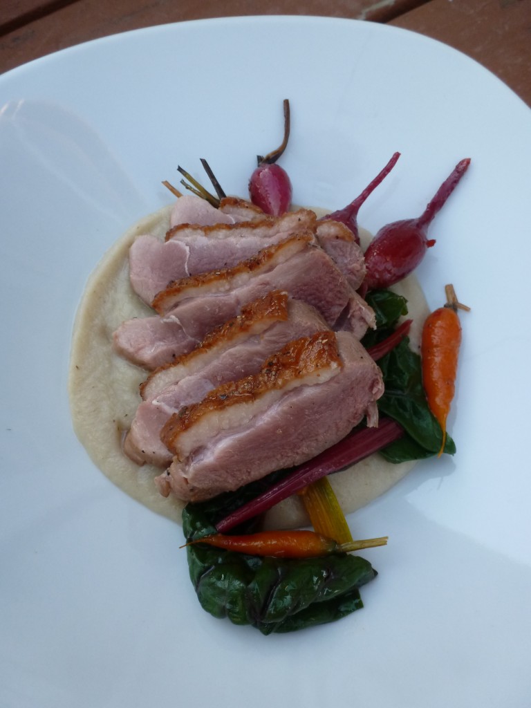Duck breast with celery root purée and baby vegetables