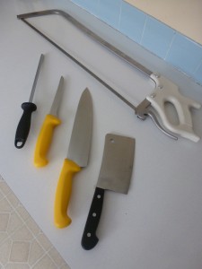 The equipment required for cutting meat at home: a handsaw, cleaver, French knife, boning knife, and steel