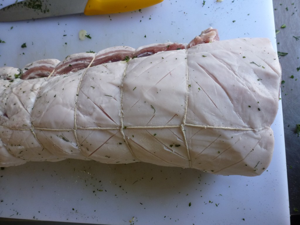 Tying up a rolled pork belly