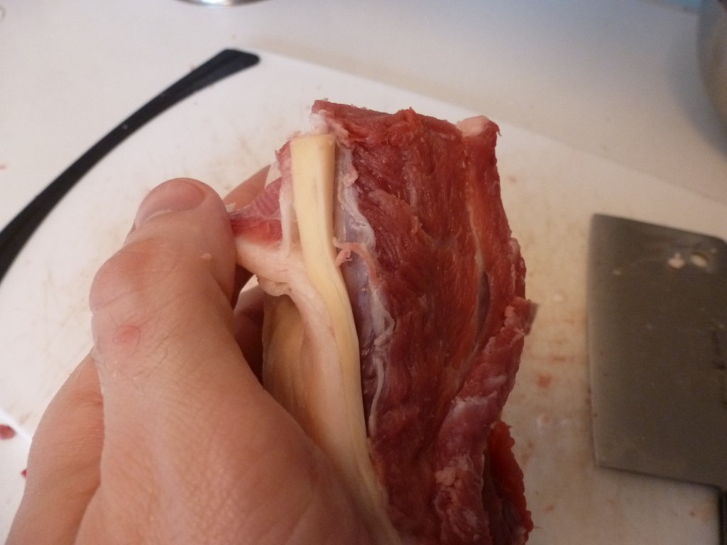 The backstrap on a lamb rack: kind of looks like a yellow rubber band