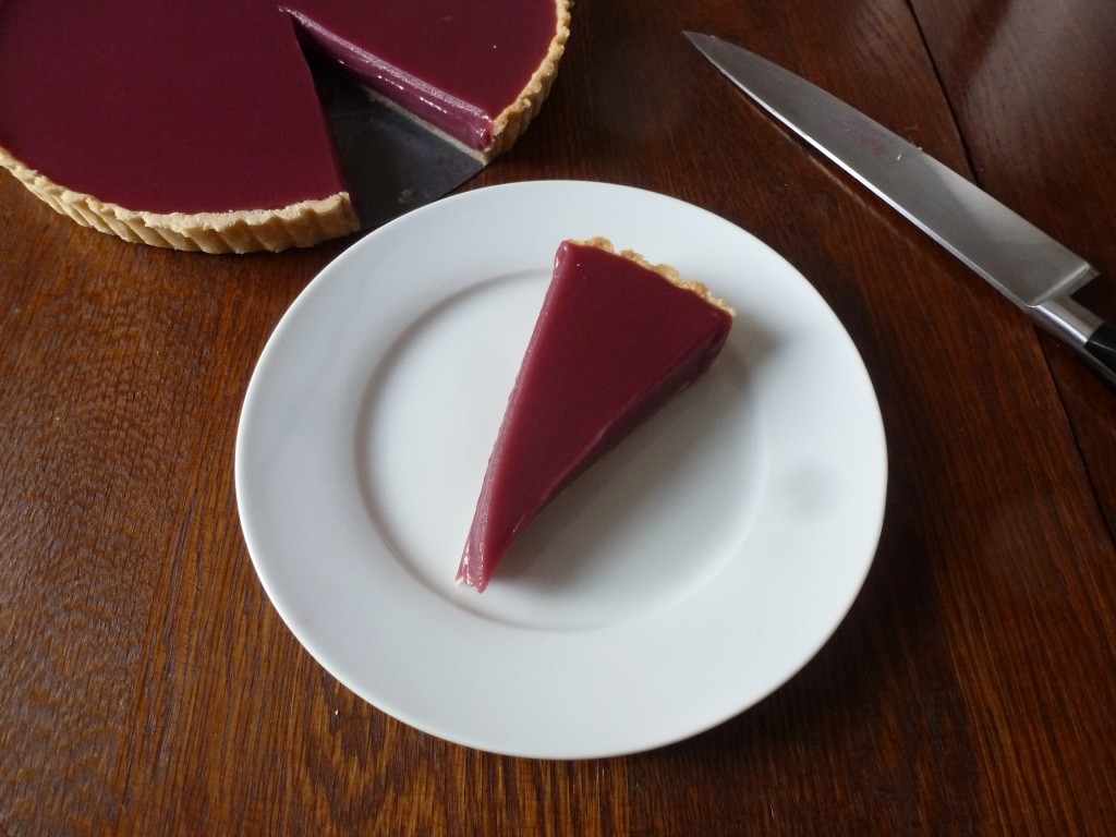 A slice of Carmine Jewel sour cherry tart