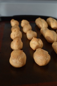 Choux pastries ready to be stuffed with whipped cream