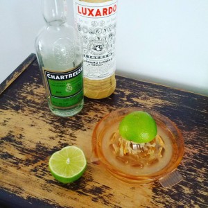 Juicing limes to make a cocktail called The Last Word