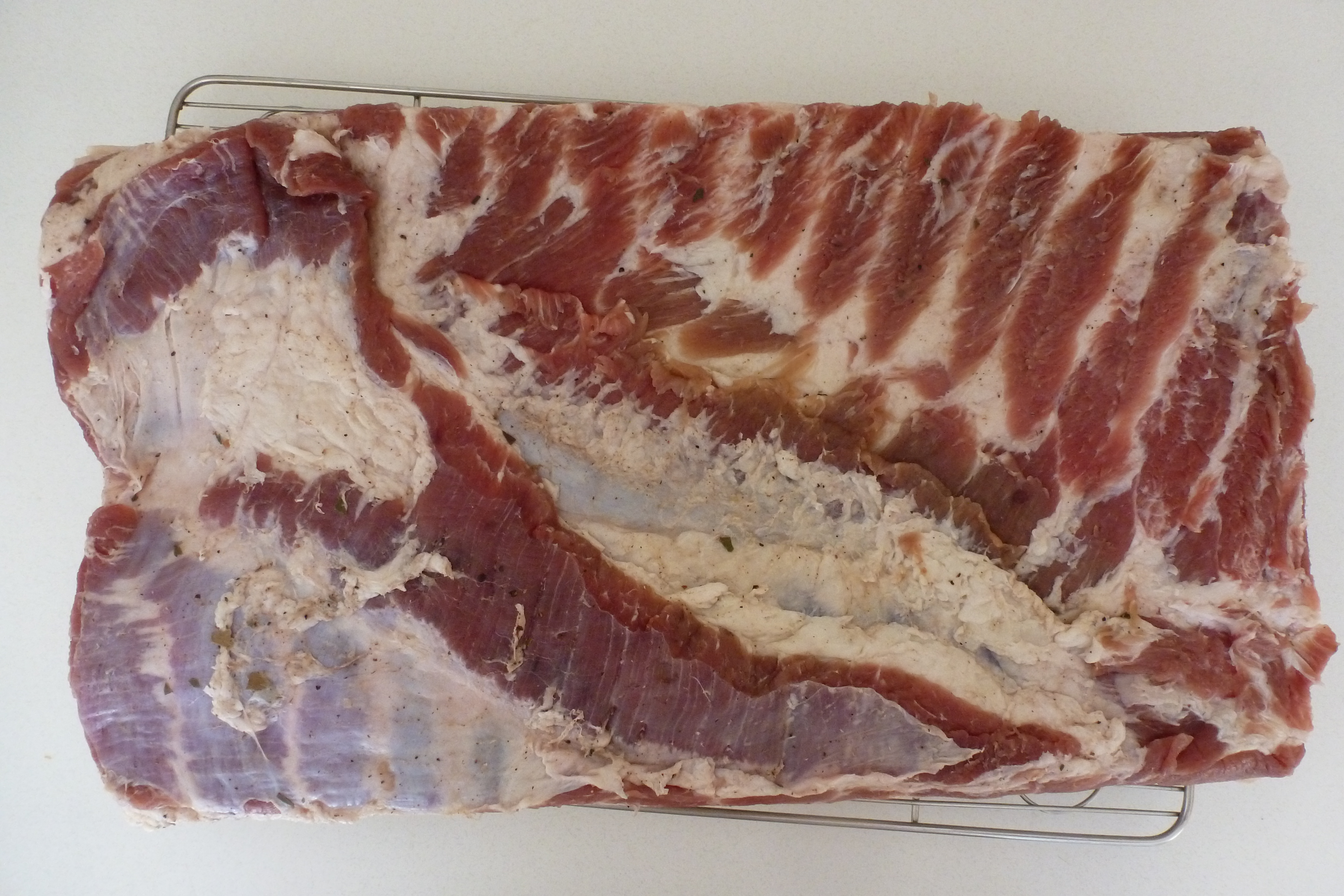 A cured slab of belly
