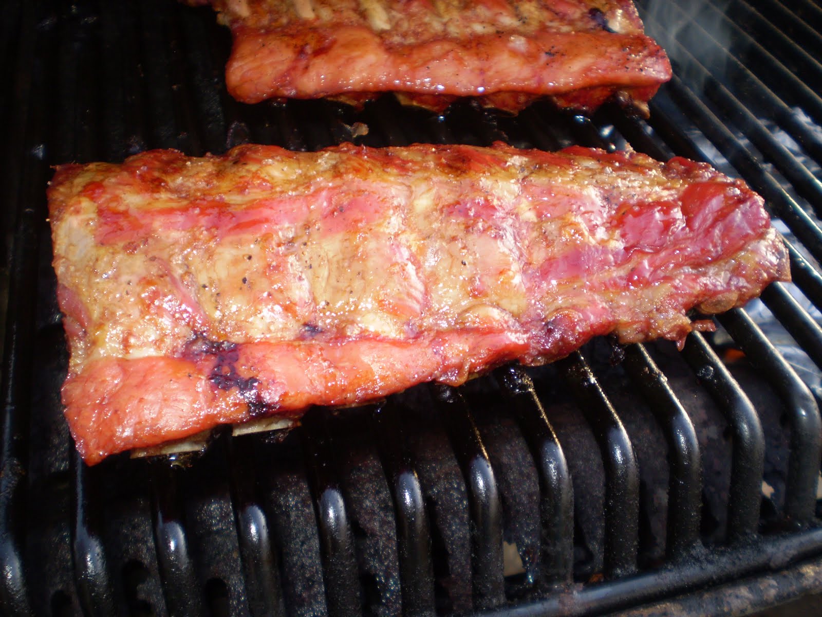 Side ribs smoking on the barbecue