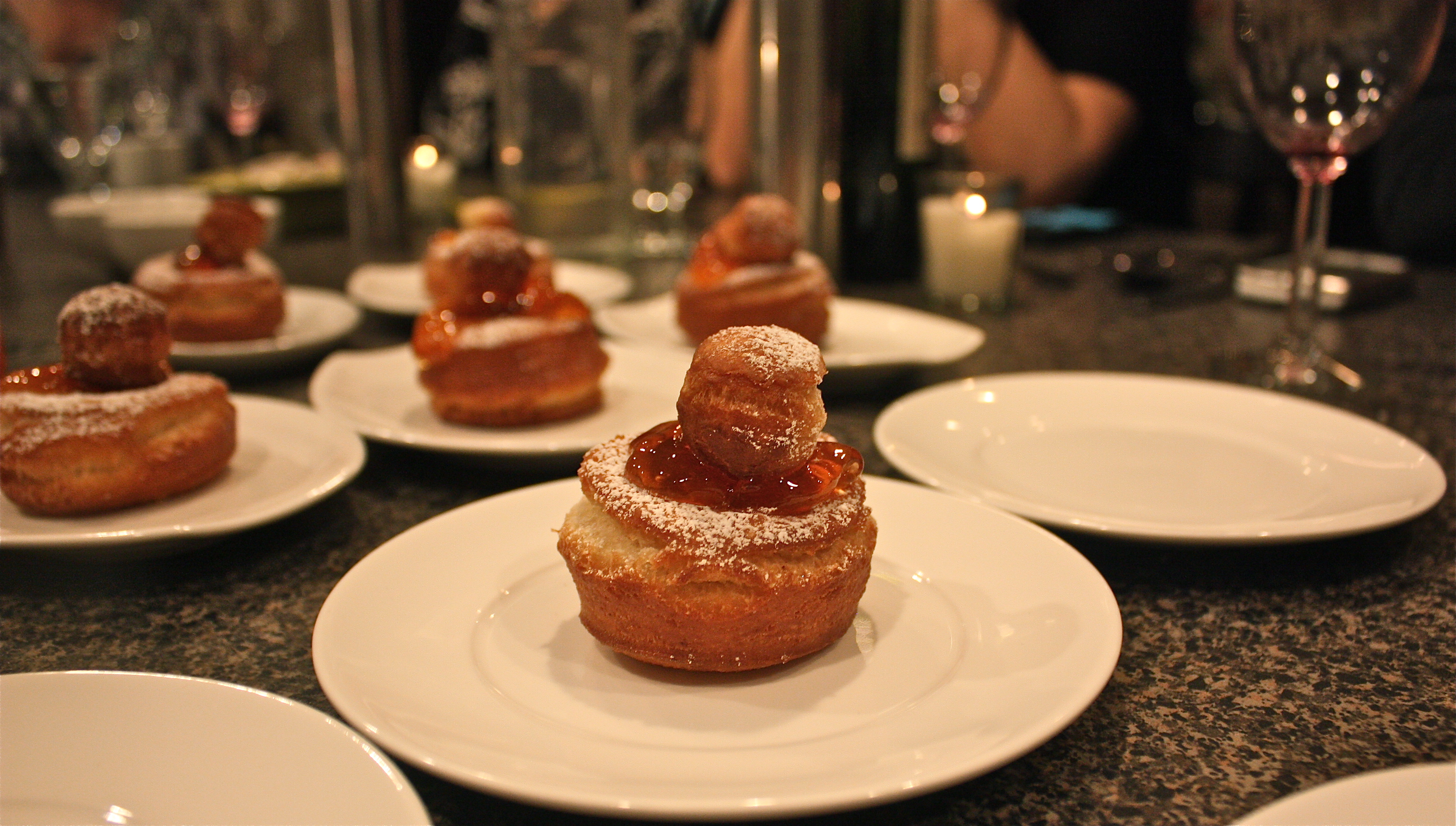 Raised doughnuts with rosehip jelly and powdered sugar