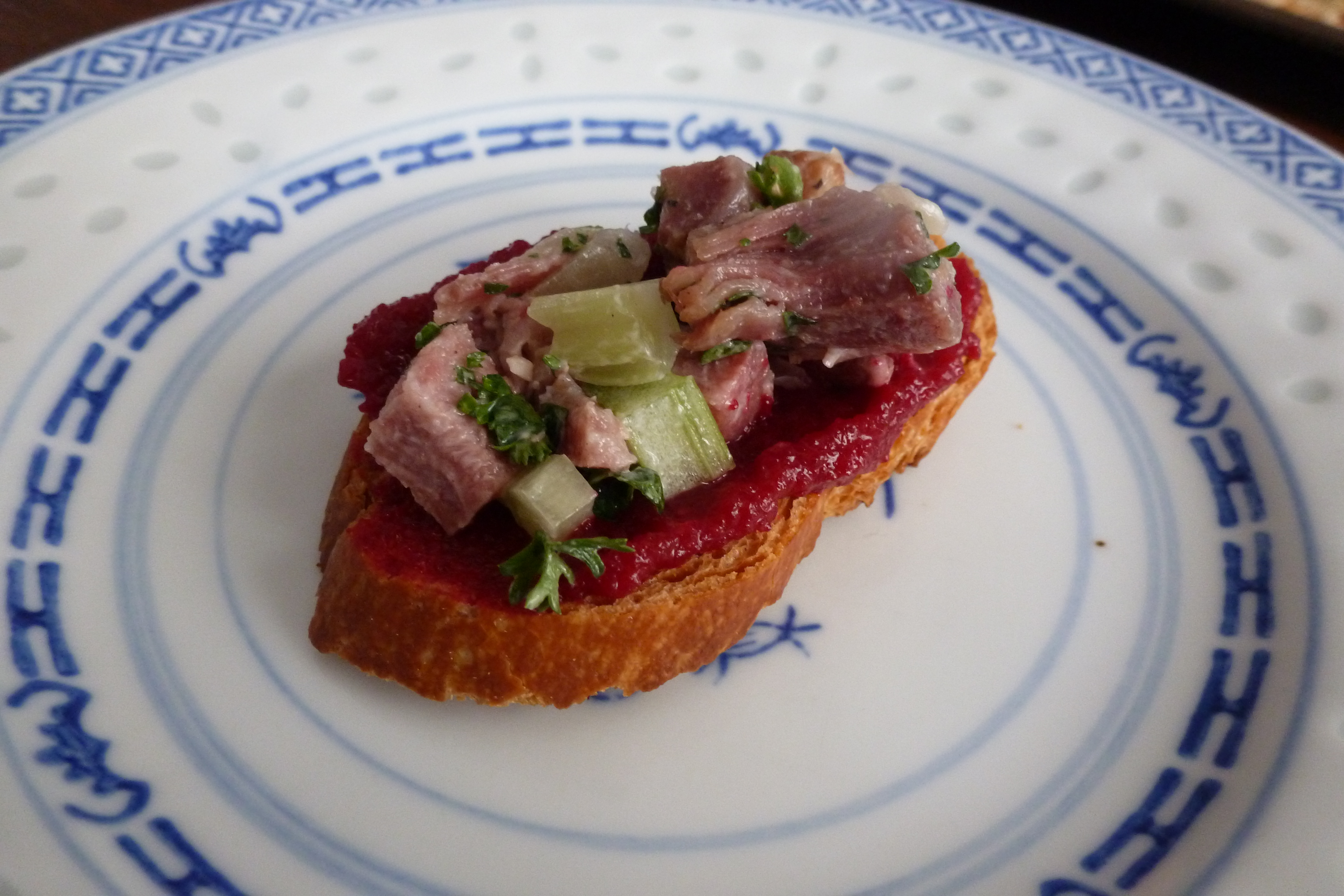 Chopped tongue on toast with beet ketchup