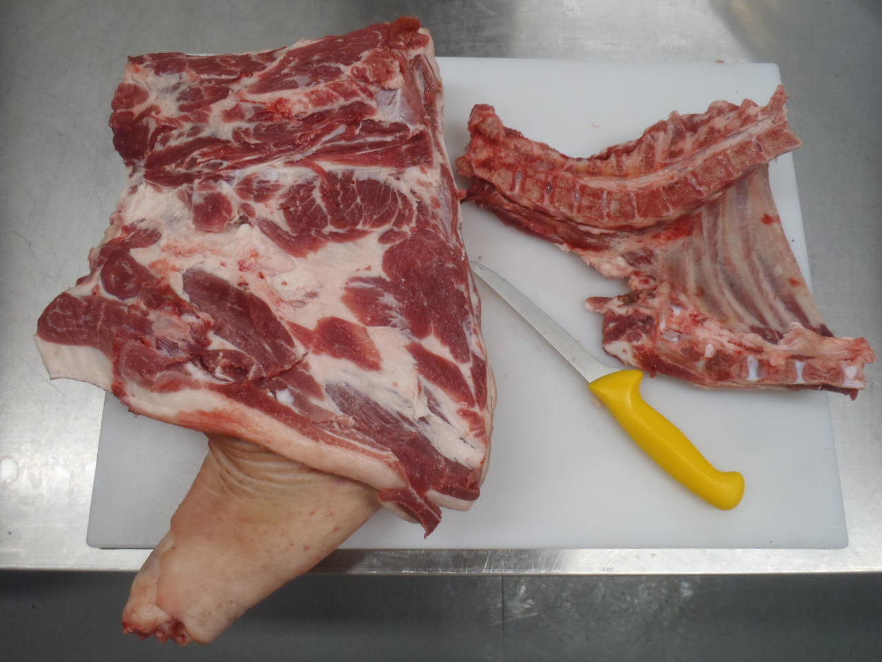 The neck bones and riblets, removed from the pork shoulder