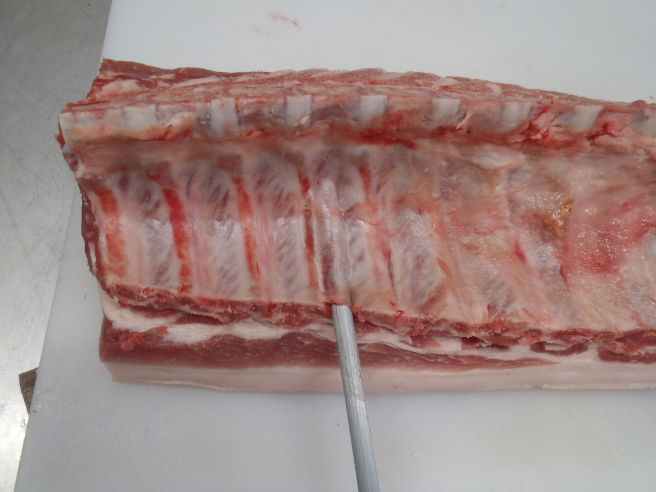 Removing the membrane from the back ribs