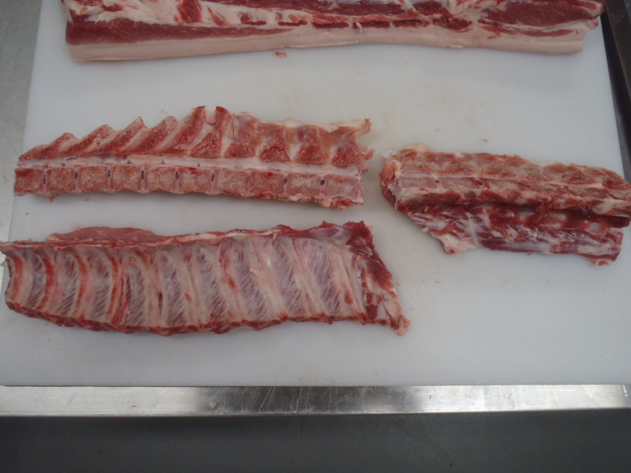 Removing the chine and feather bones from the back ribs