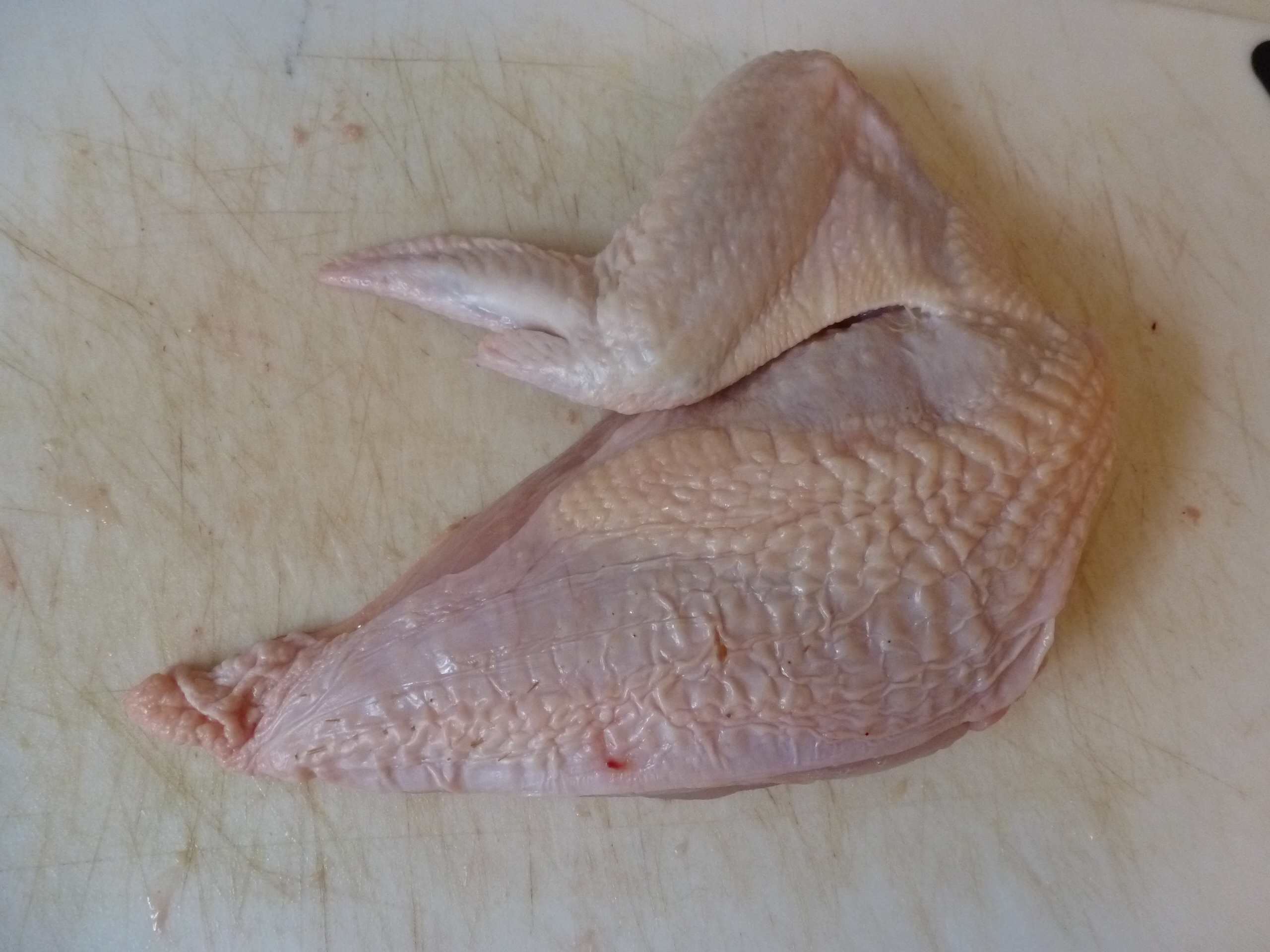 The chicken breast, with wing attached