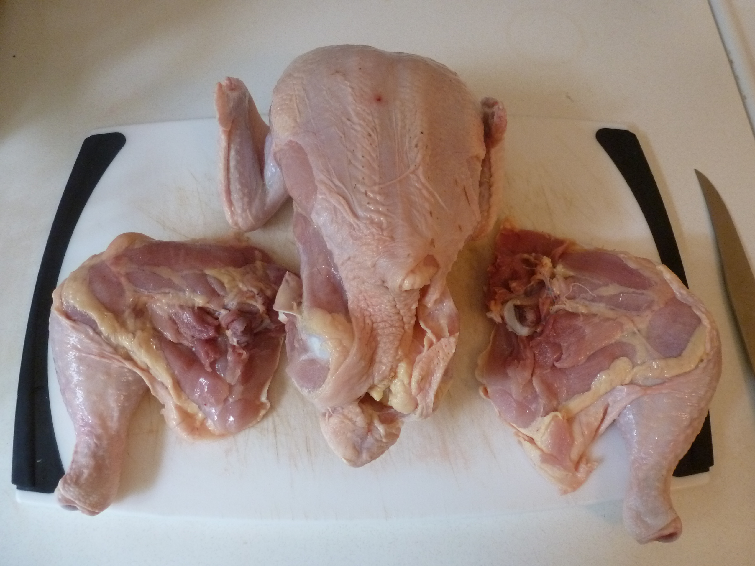The chicken with both legs separated