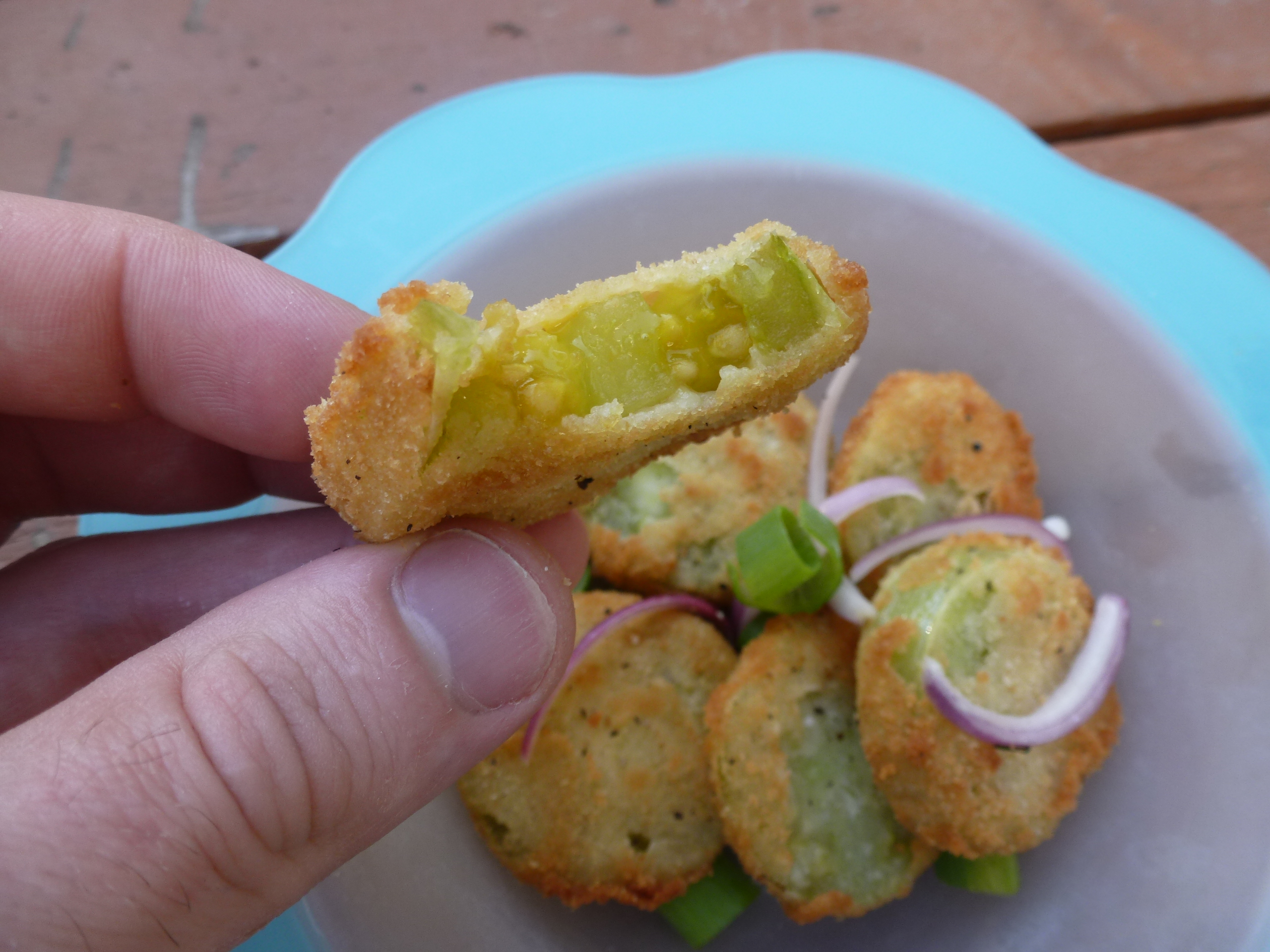 Biting into a fried green tomato