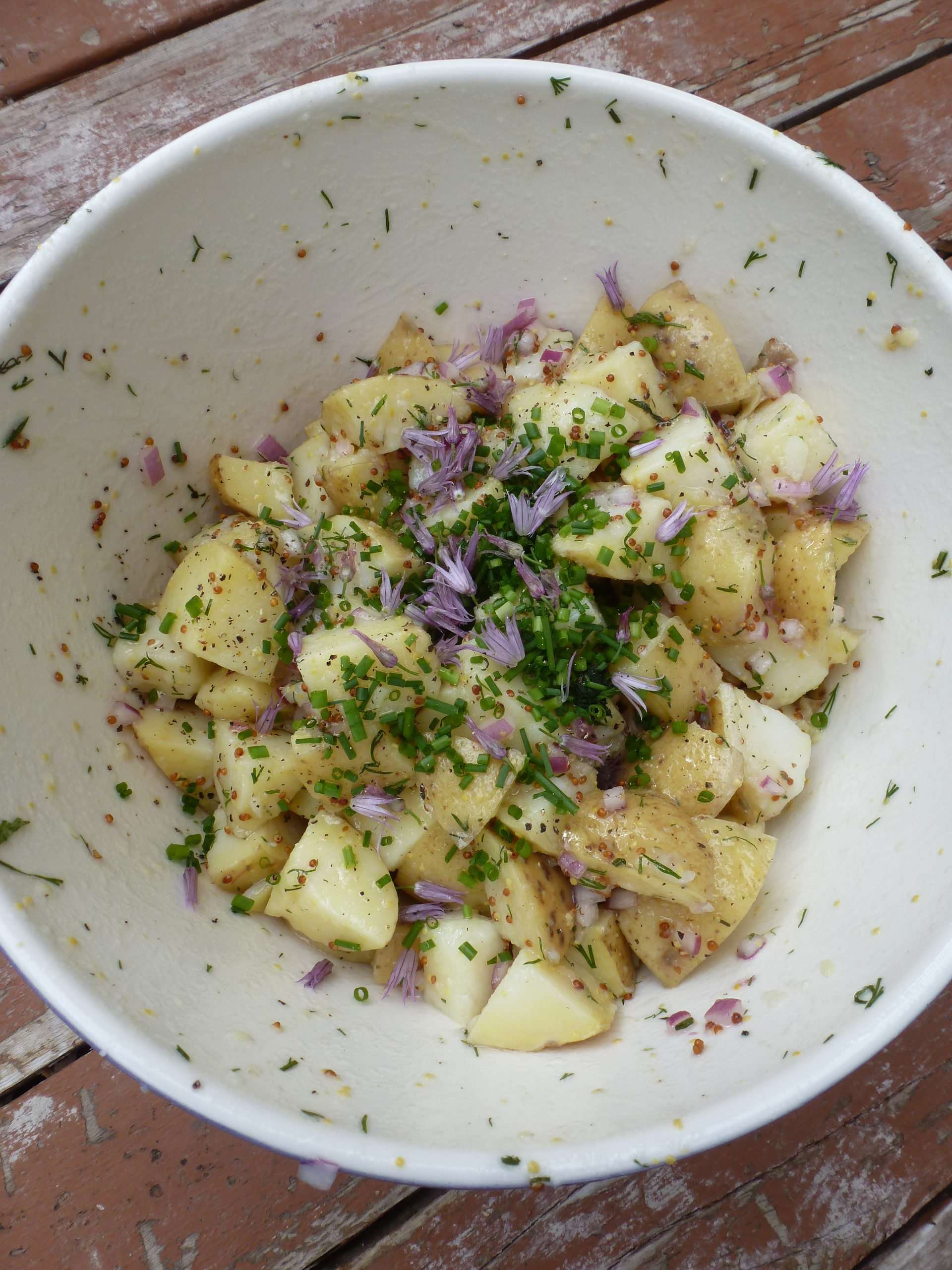 A bowl of potato salad, with lots of chives