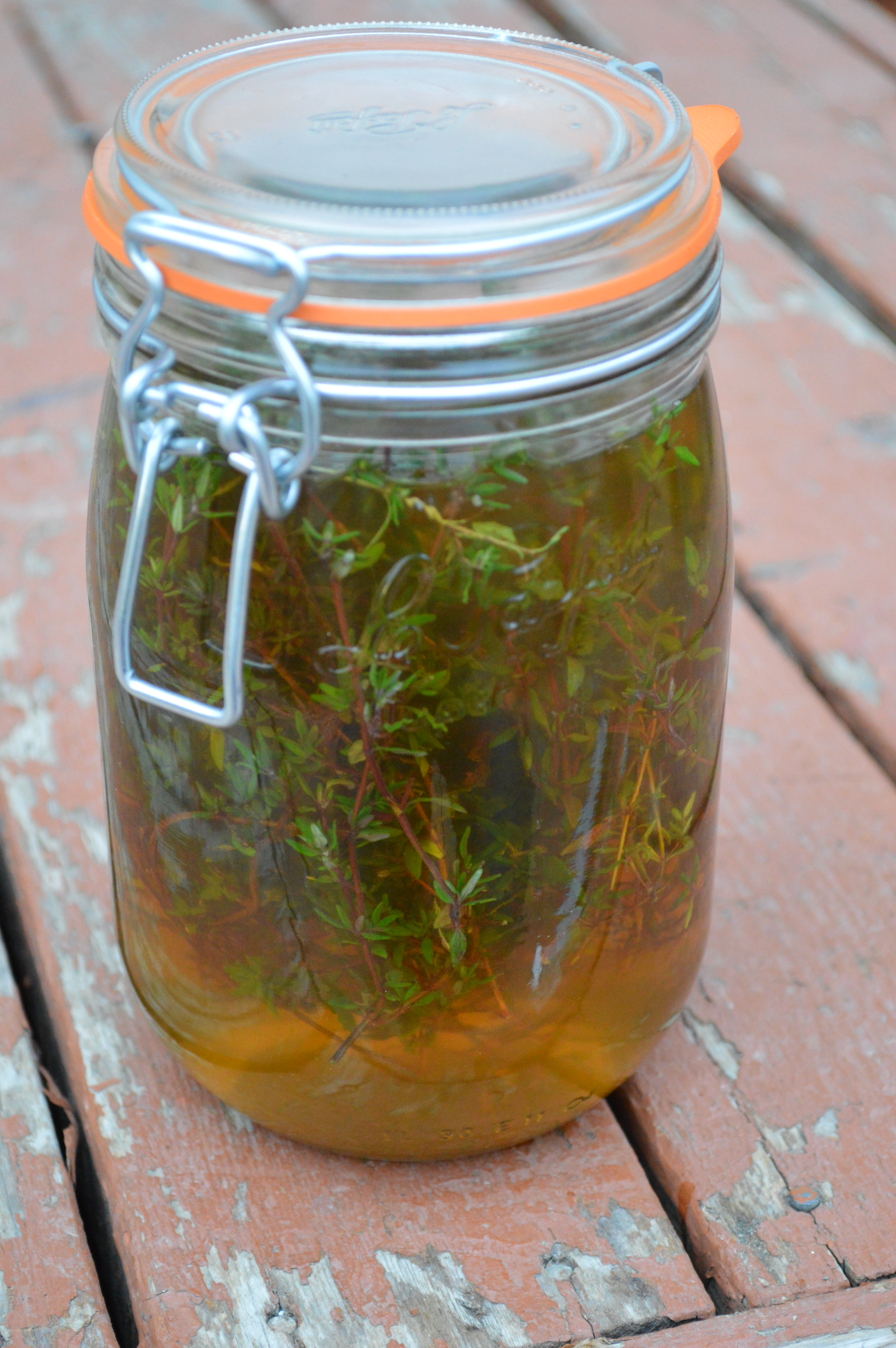 A jar of thyme vinegar.