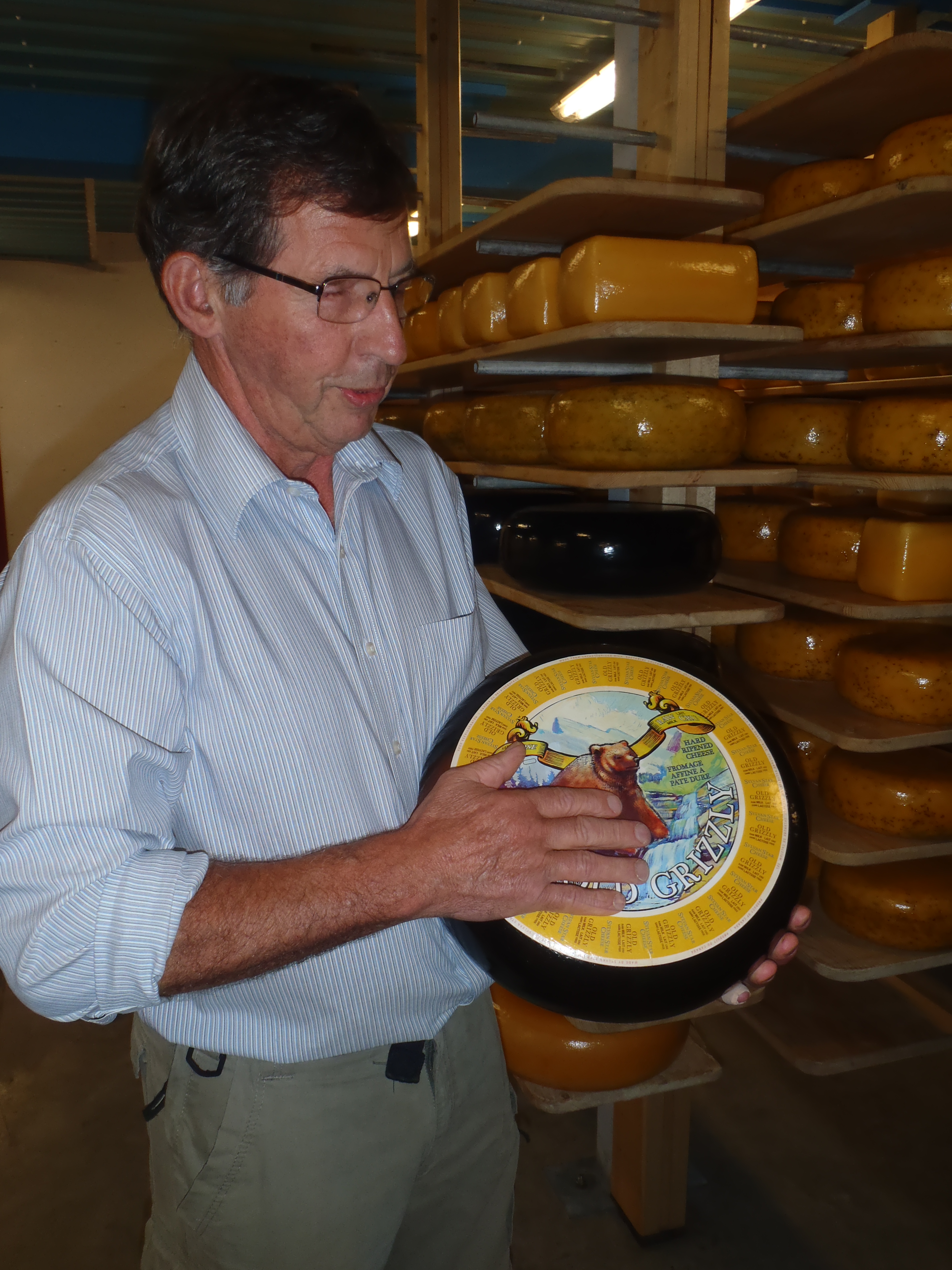 Sylvan Star owner Jan with a wheel of Grizzly aged gouda