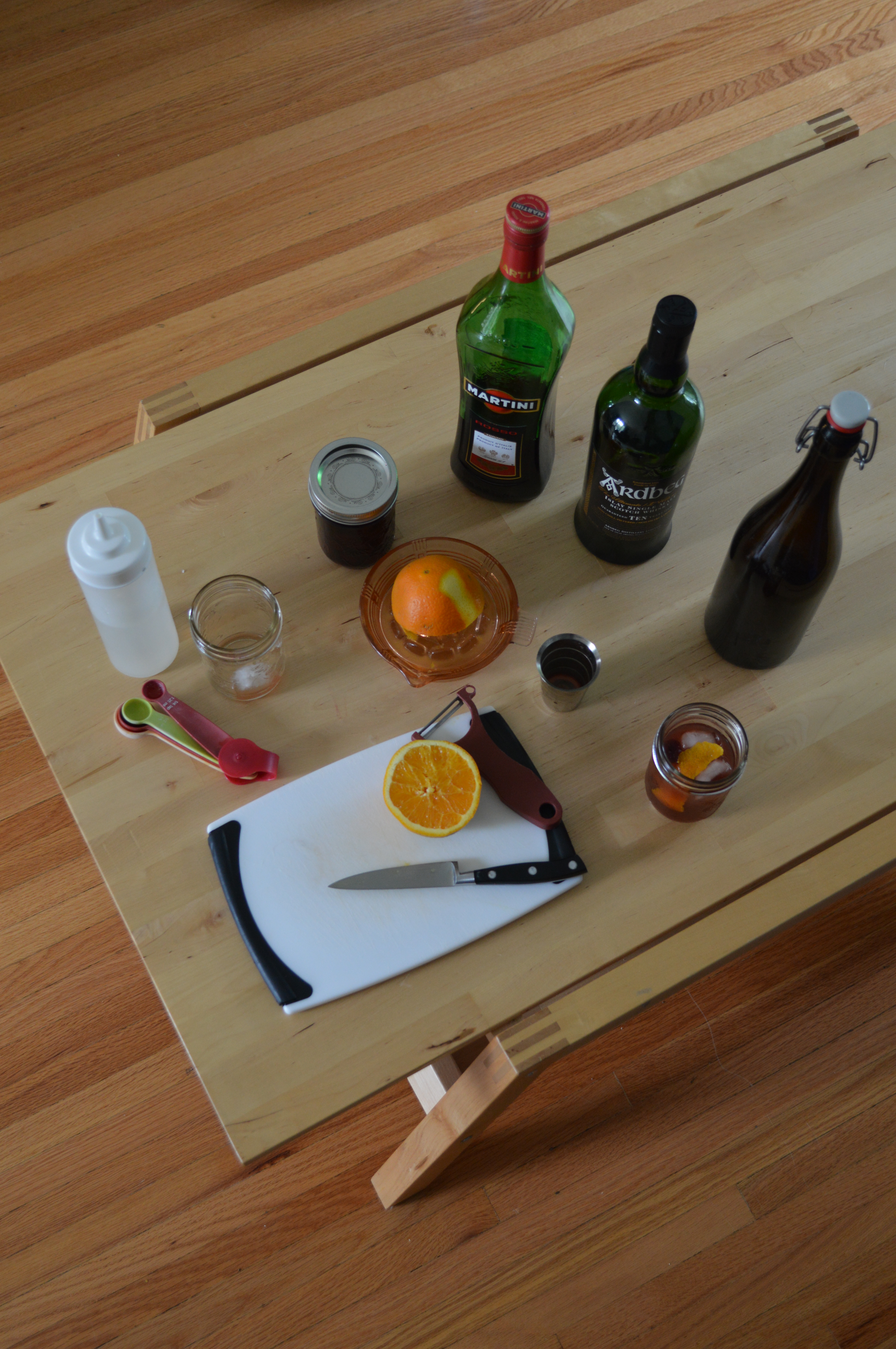 The ingredients and equipment needed to make an interesting twist on the classic Blood and Sand cocktail.