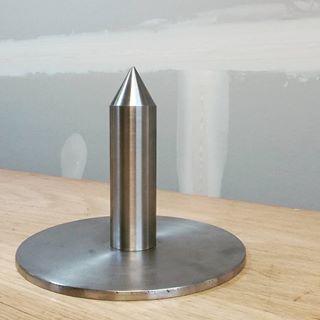 A "bun punch"... a thick steel spike used to hollow out baguettes for the insertion of a sausage.