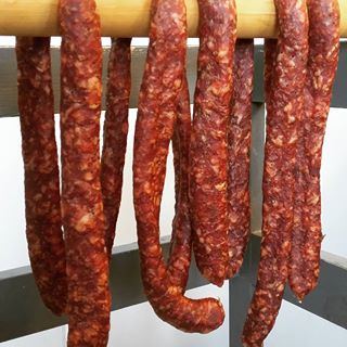 Pepperoni hanging and drying.