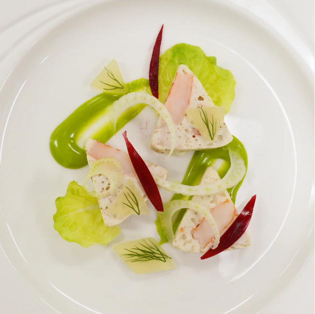 A plate of chicken and shrimp terrine with green mayonnaise.